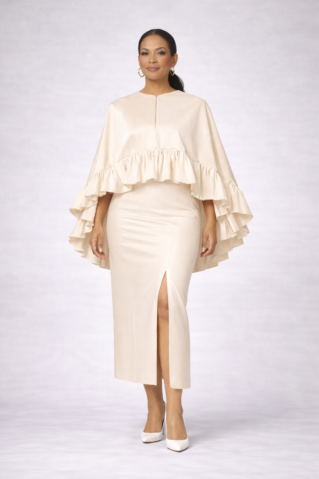 Elegant cream two-piece cape and pencil skirt set featuring ruffle cape detail and front slit skirt, made from silk stretch taffeta
